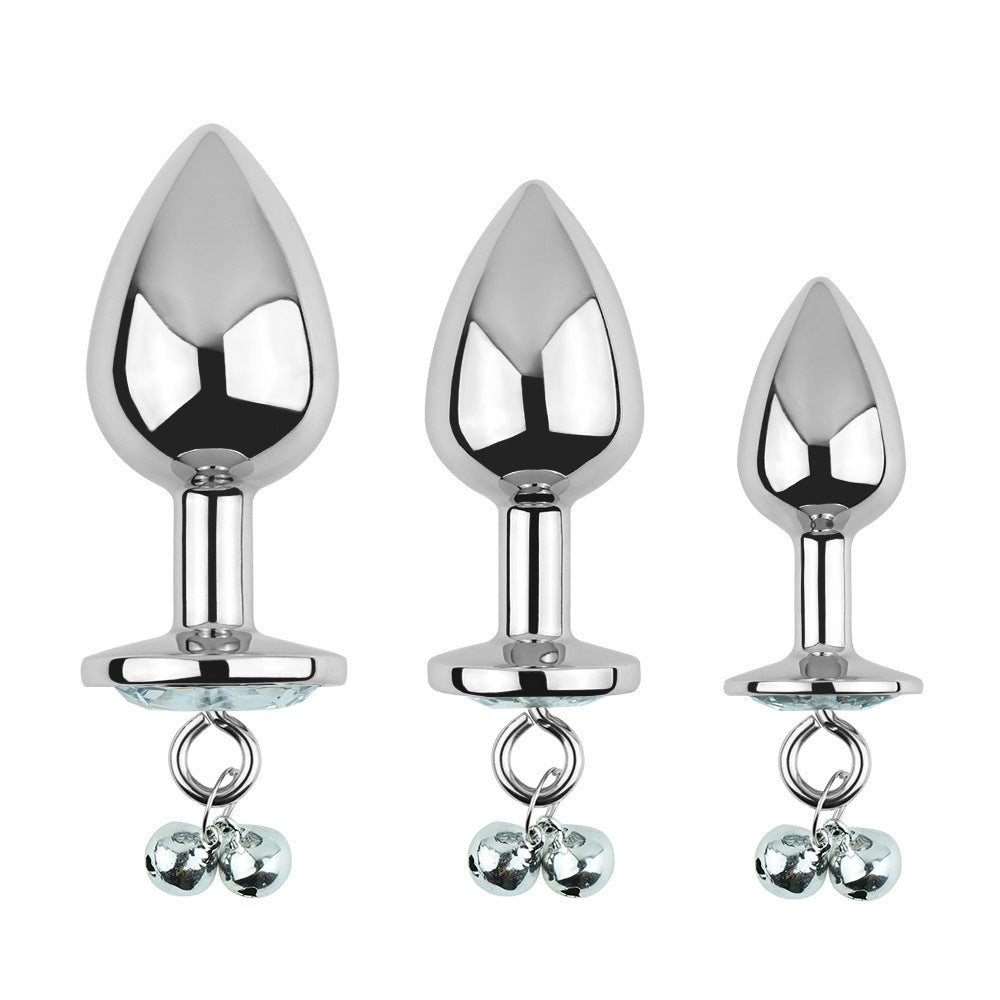 Plug anal blanc avec bijoux, cloches et laisse