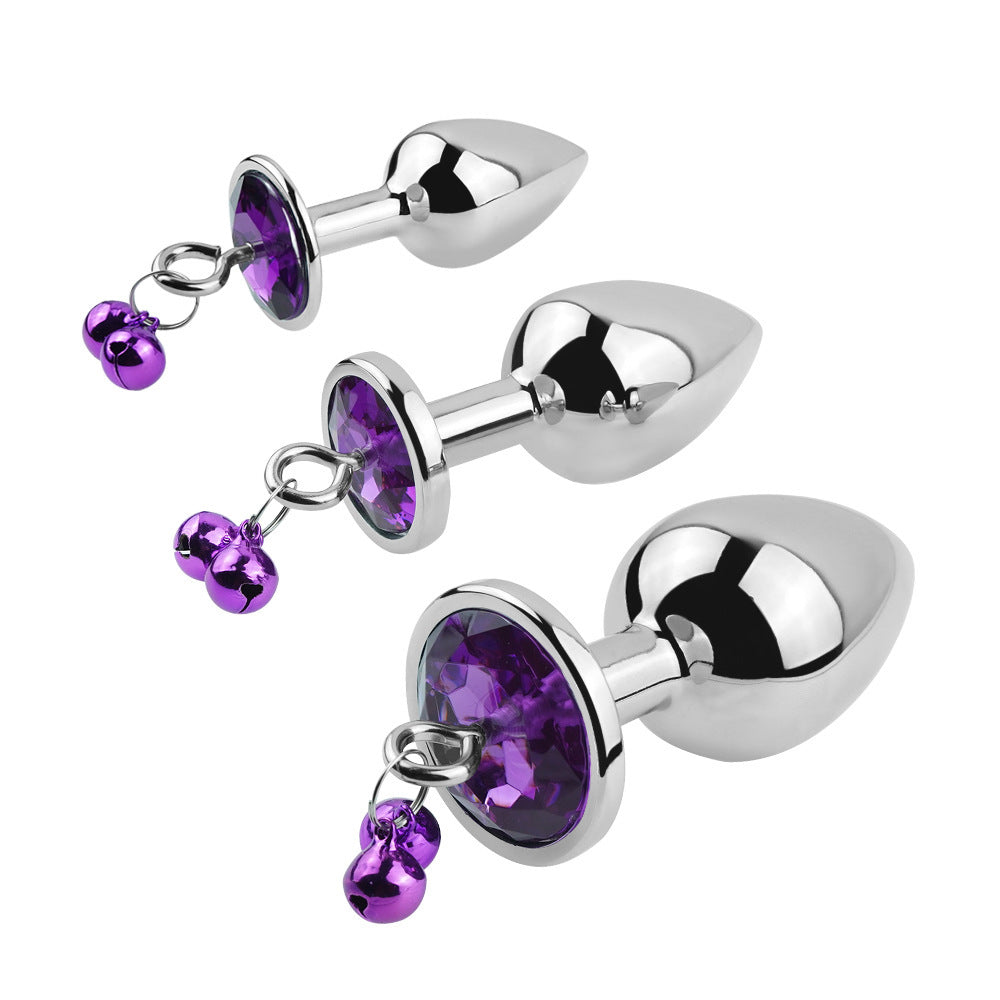 Plug anal violet avec bijoux, cloches et laisse