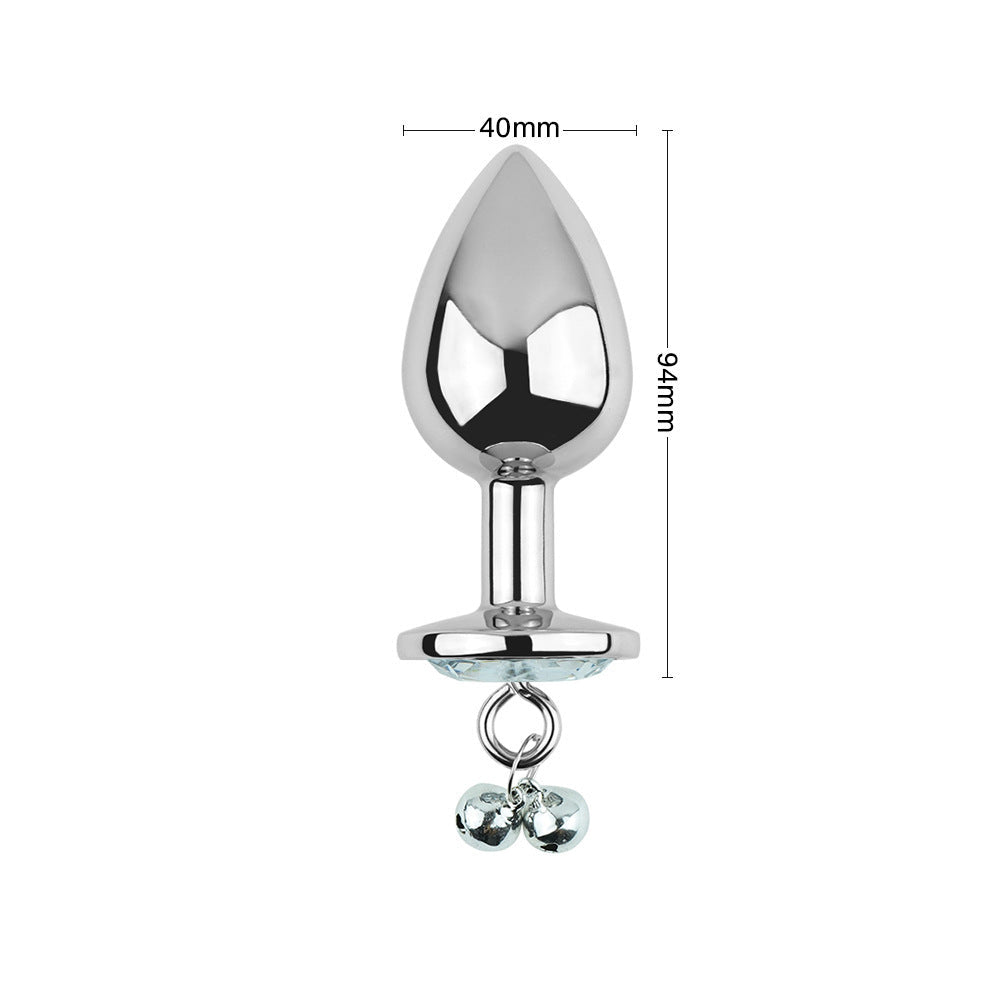 Plug anal blanc avec bijoux, cloches et laisse