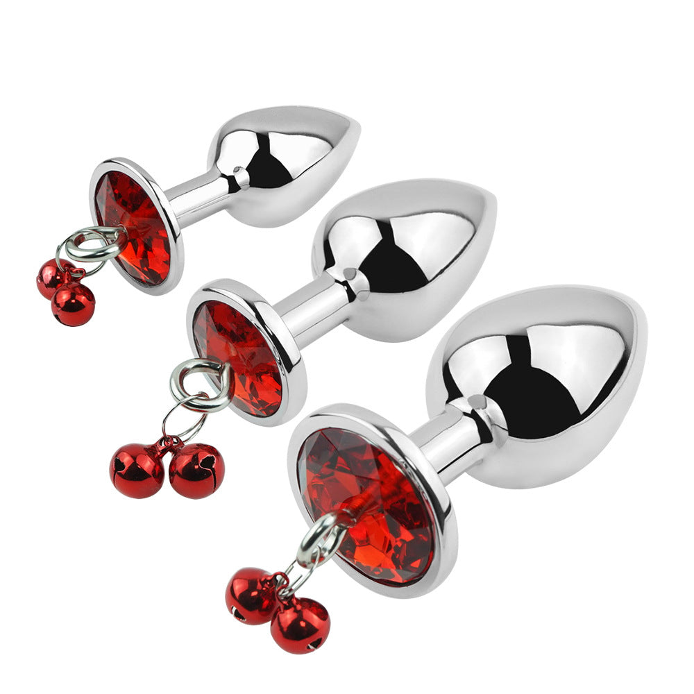 Plug anal rouge avec bijoux, cloches et laisse