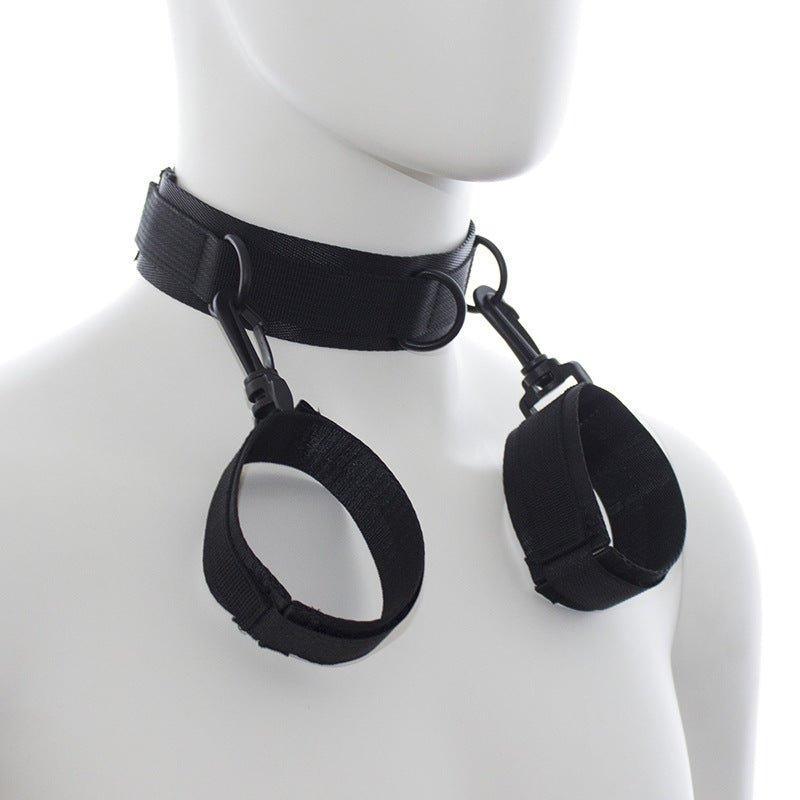 Side view of BDSM neck and hand cuffs