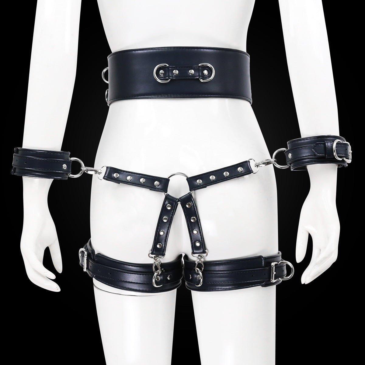 Black BDSM bondage leg cuffs set with silver details