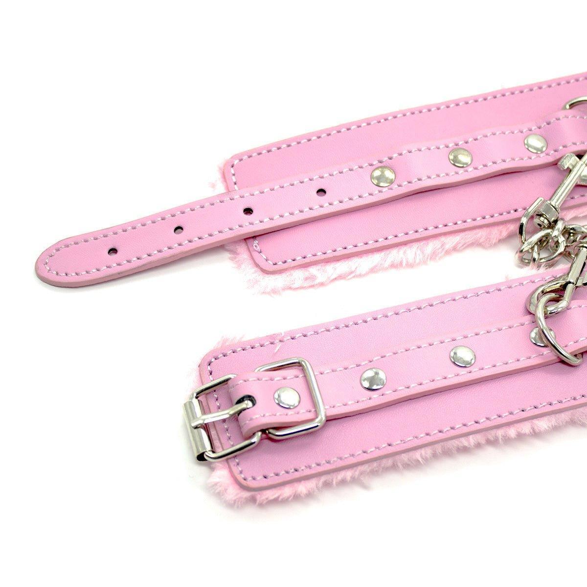 Pink fur-lined BDSM wrist restraints with chain