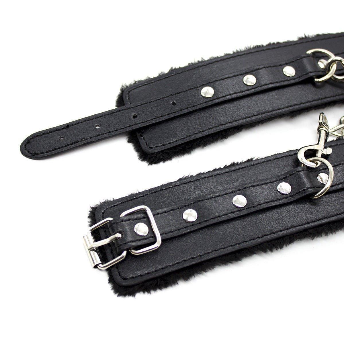 Black fur-lined BDSM wrist restraints with chain