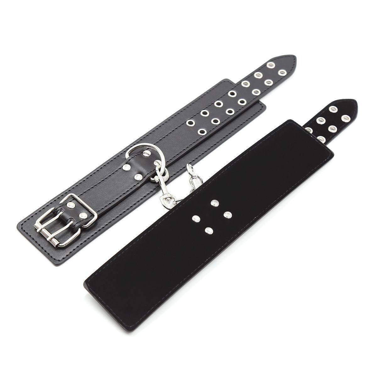 Black leather BDSM cuffs with metal clasp