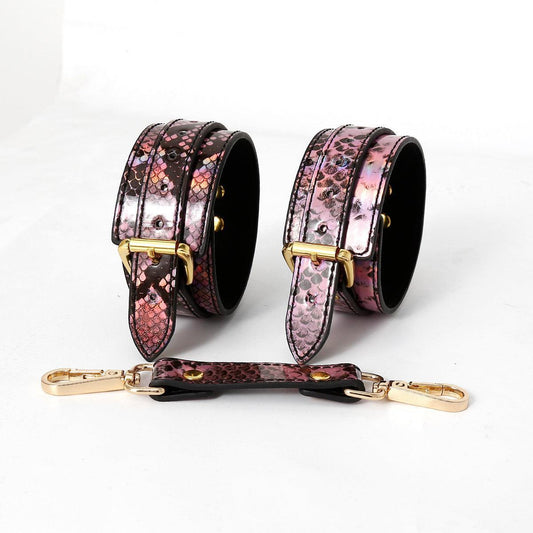 Snake pattern hand cuffs with gold buckles